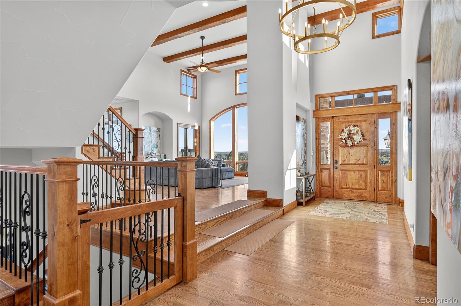 5001 Raintree Circle Parker, CO 80134 - Photo 13 of 50 a view of an entryway with wooden floor