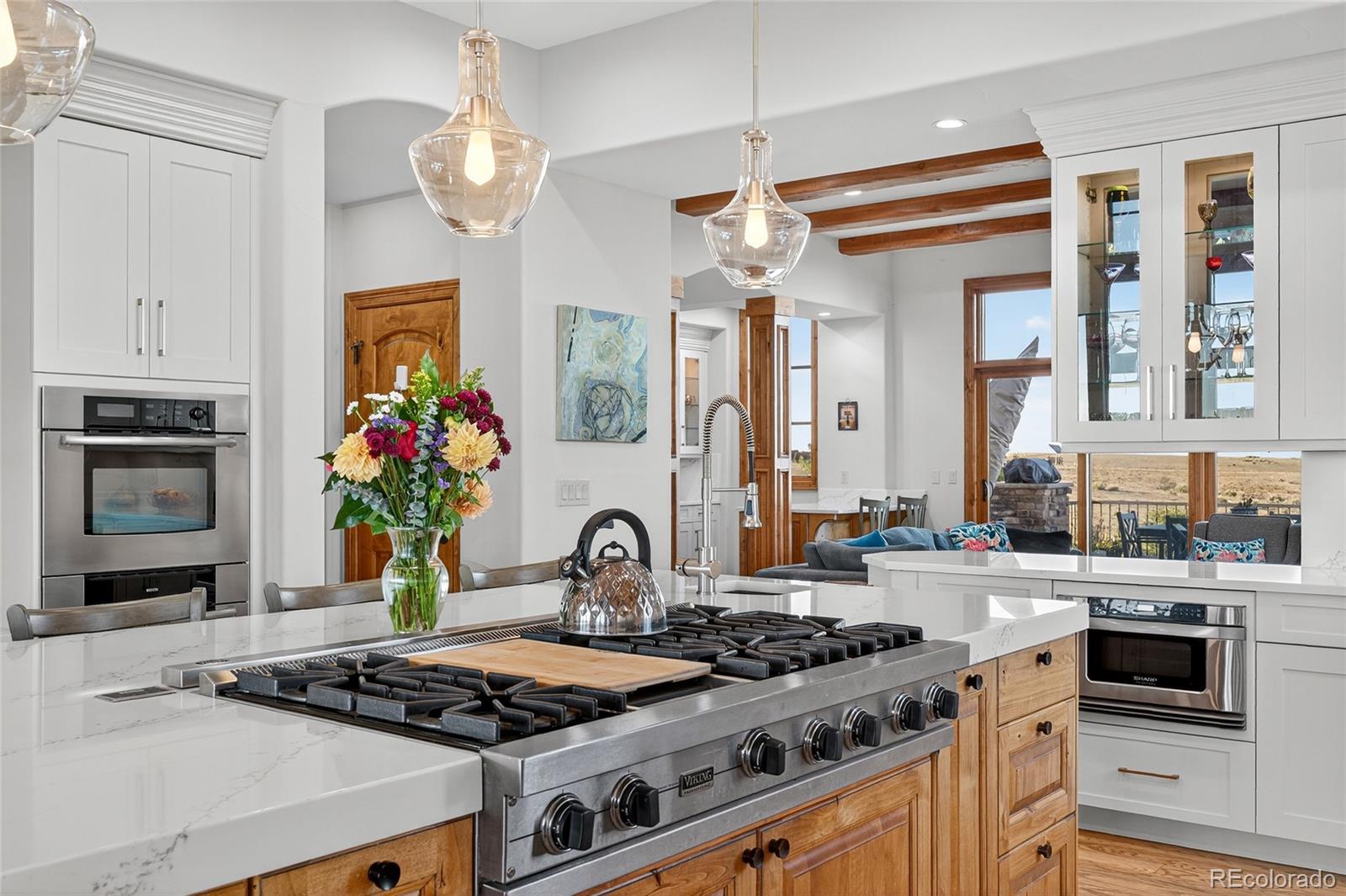 5001 Raintree Circle Parker, CO 80134 - Photo 22 of 50 a kitchen with stainless steel appliances a stove a sink and a refrigerator