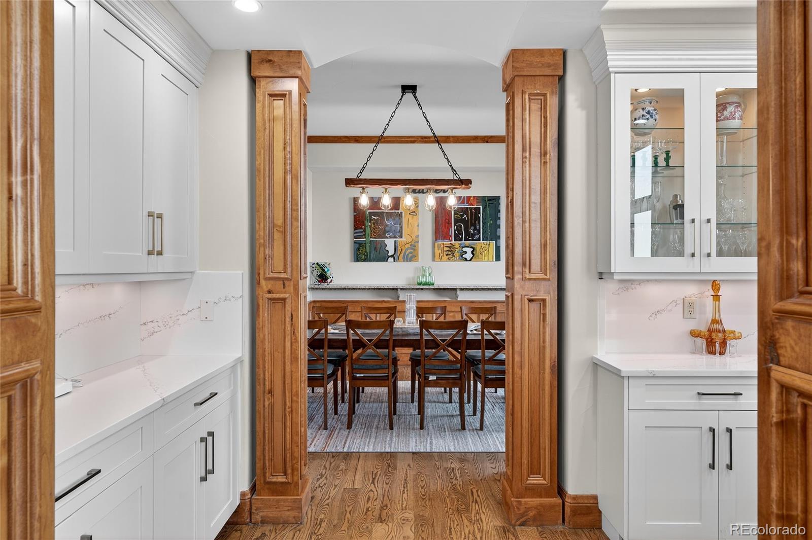 5001 Raintree Circle Parker, CO 80134 - Photo 25 of 50 a view of dining room and wooden floor