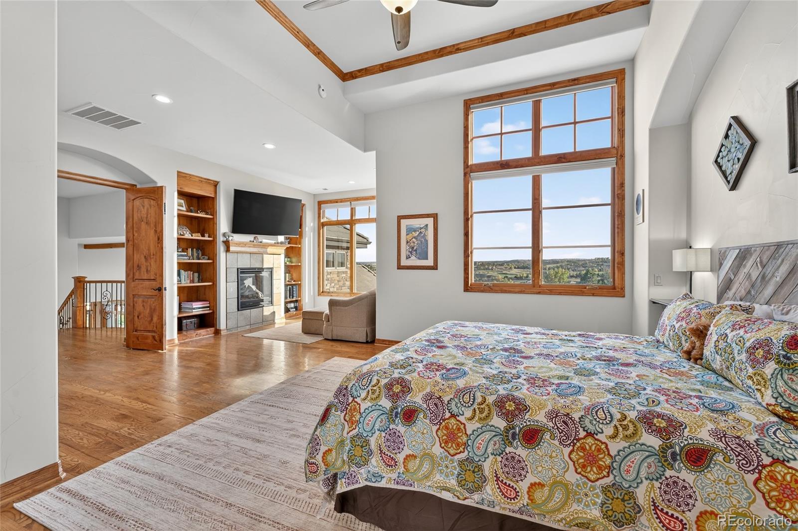 5001 Raintree Circle Parker, CO 80134 - Photo 29 of 50 a bedroom with a large bed and a window