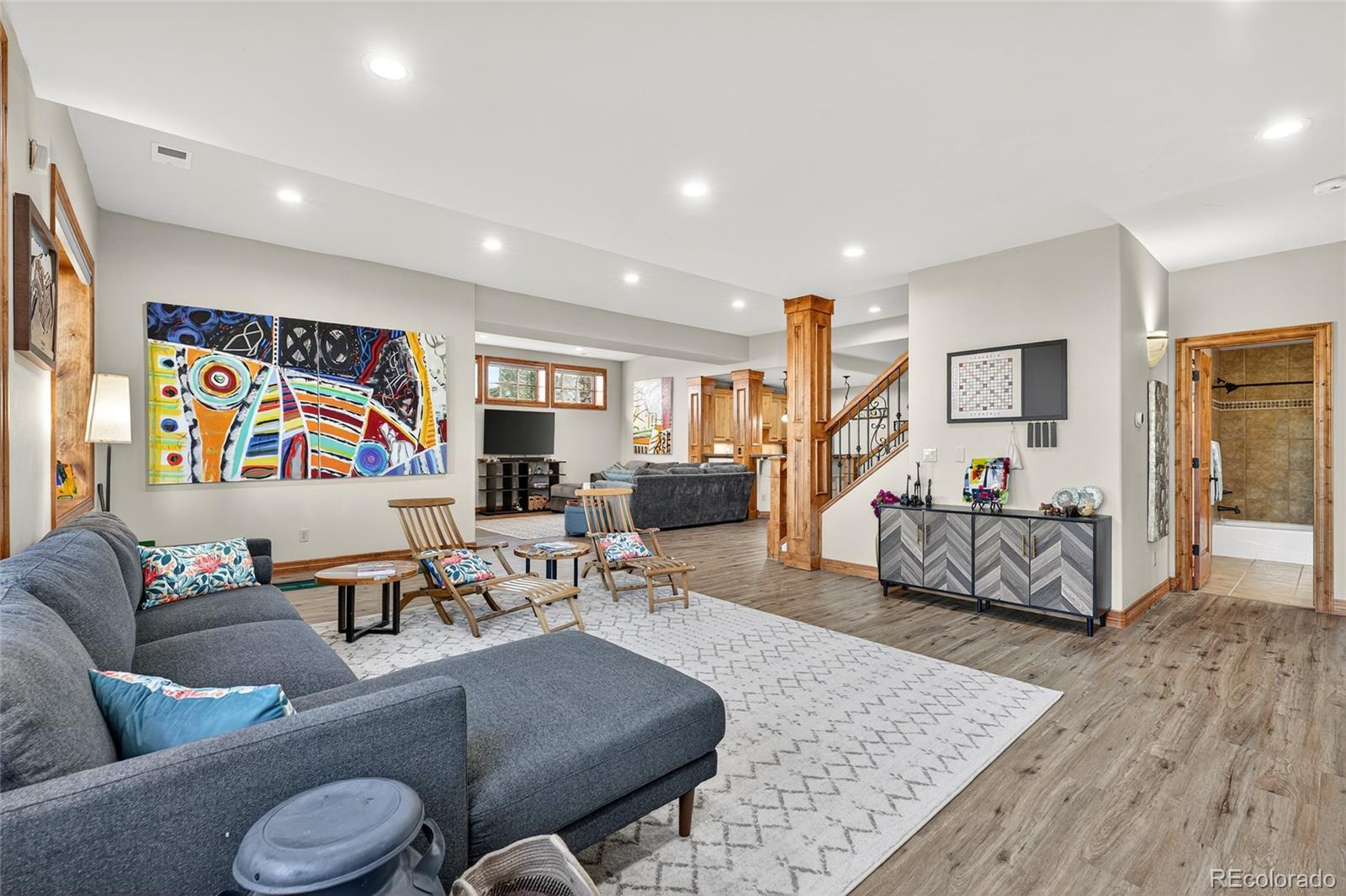 5001 Raintree Circle Parker, CO 80134 - Photo 39 of 50 a living room with furniture and wooden floor