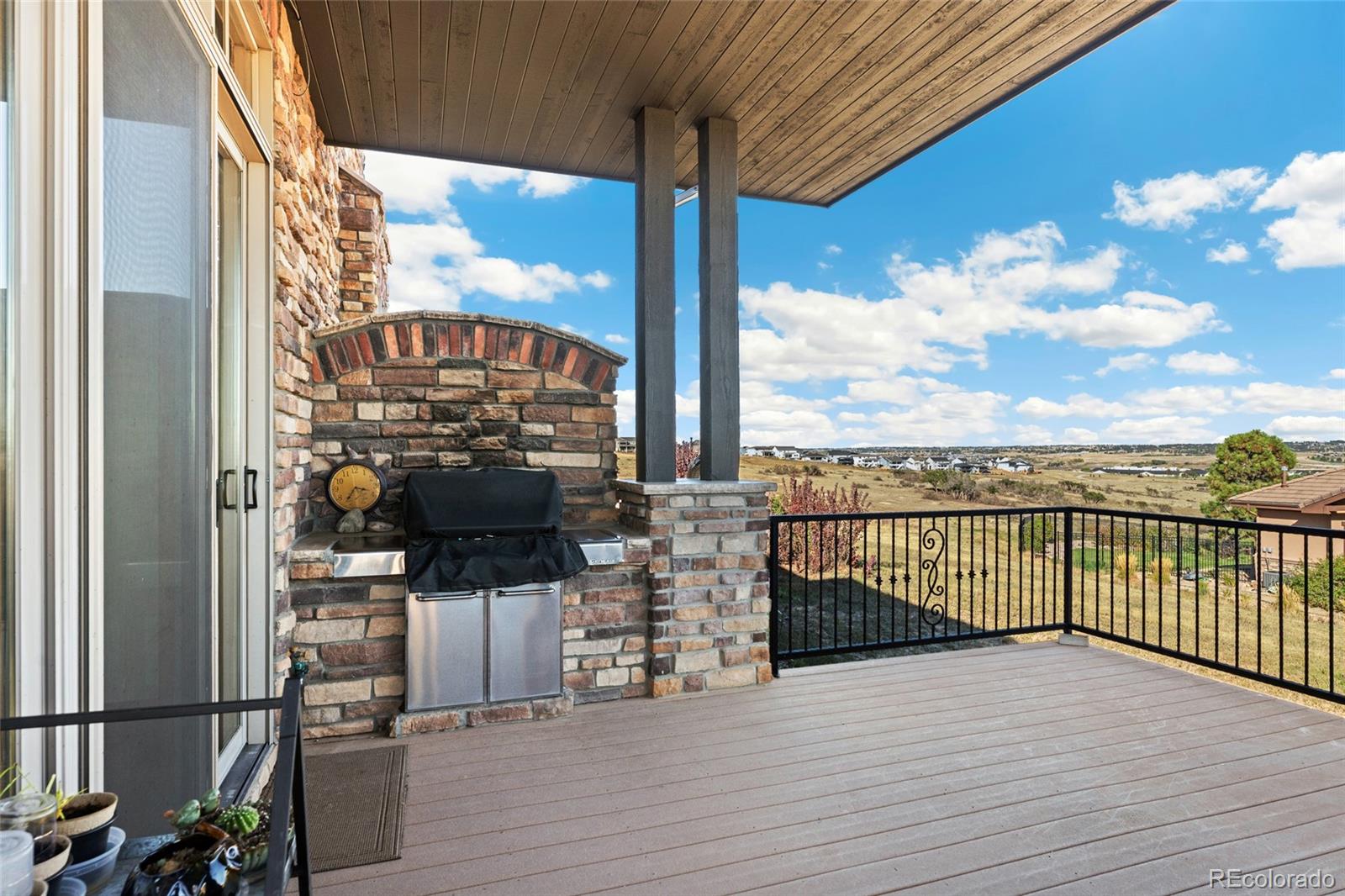 5001 Raintree Circle Parker, CO 80134 - Photo 45 of 50 a view of a balcony with wooden floor