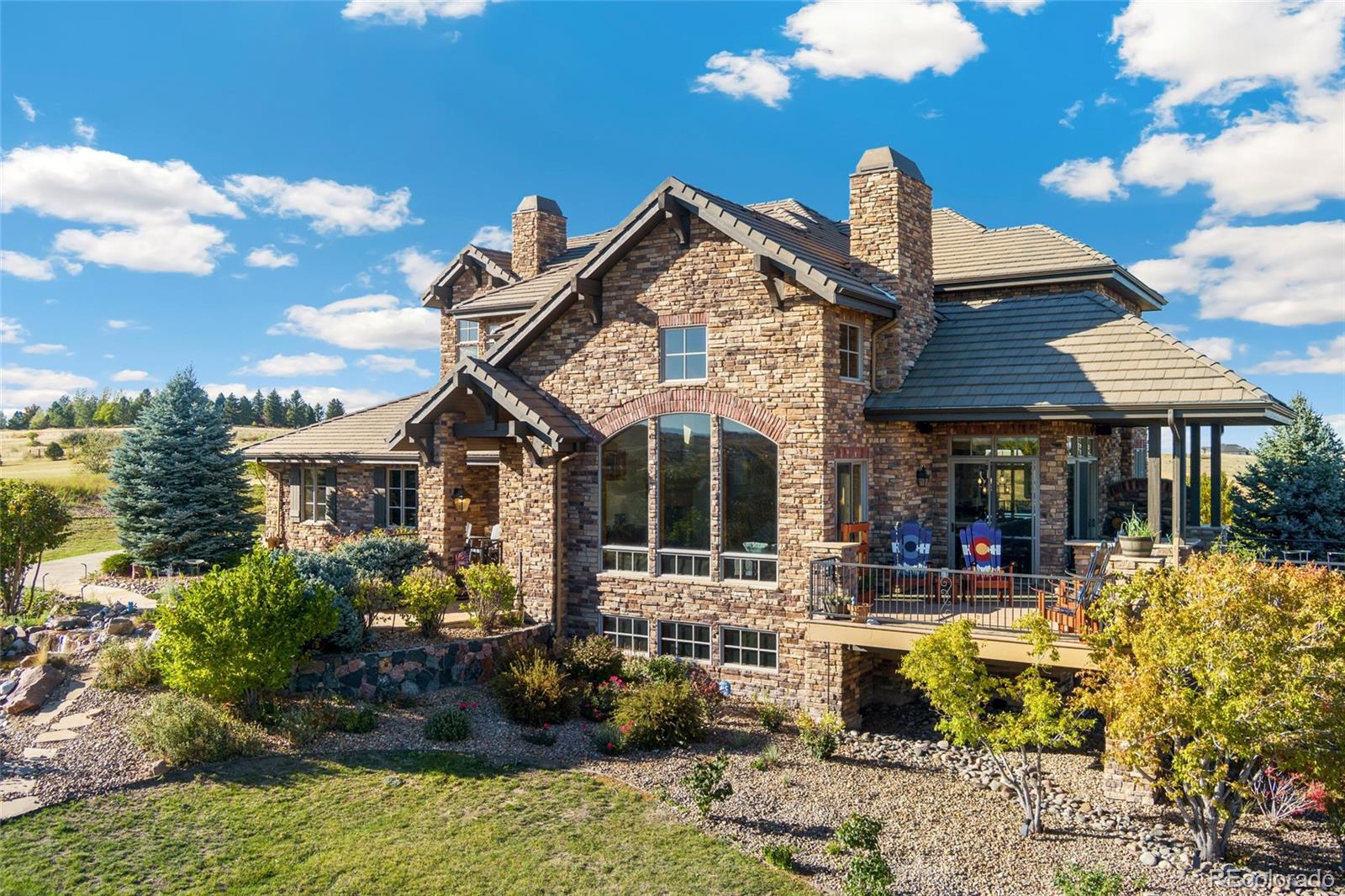 5001 Raintree Circle Parker, CO 80134 - Photo 48 of 50 a front view of a house with a porch