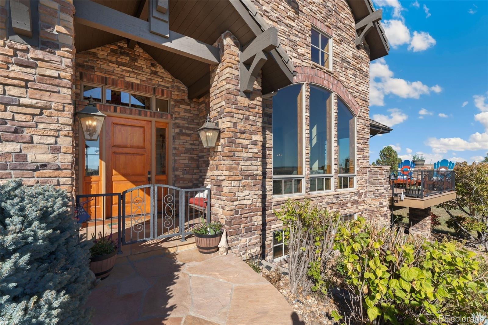 5001 Raintree Circle Parker, CO 80134 - Photo 5 of 50 front view of a house with a street