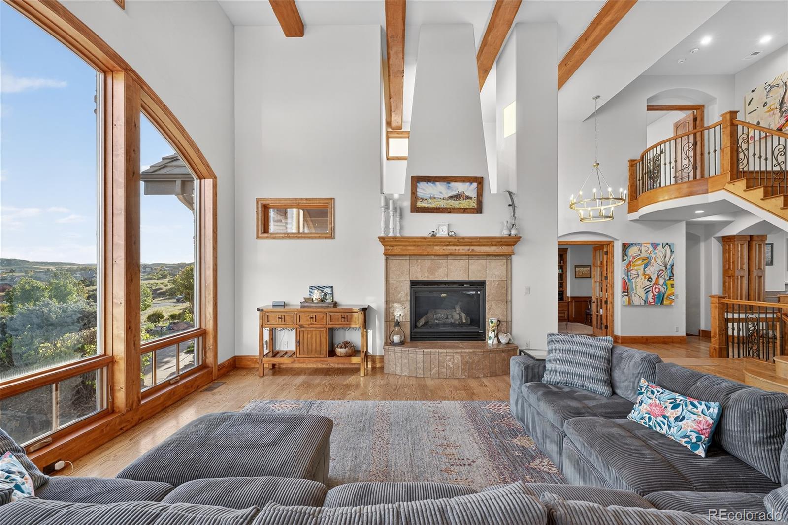 5001 Raintree Circle Parker, CO 80134 - Photo 7 of 50 a living room with furniture and a fireplace
