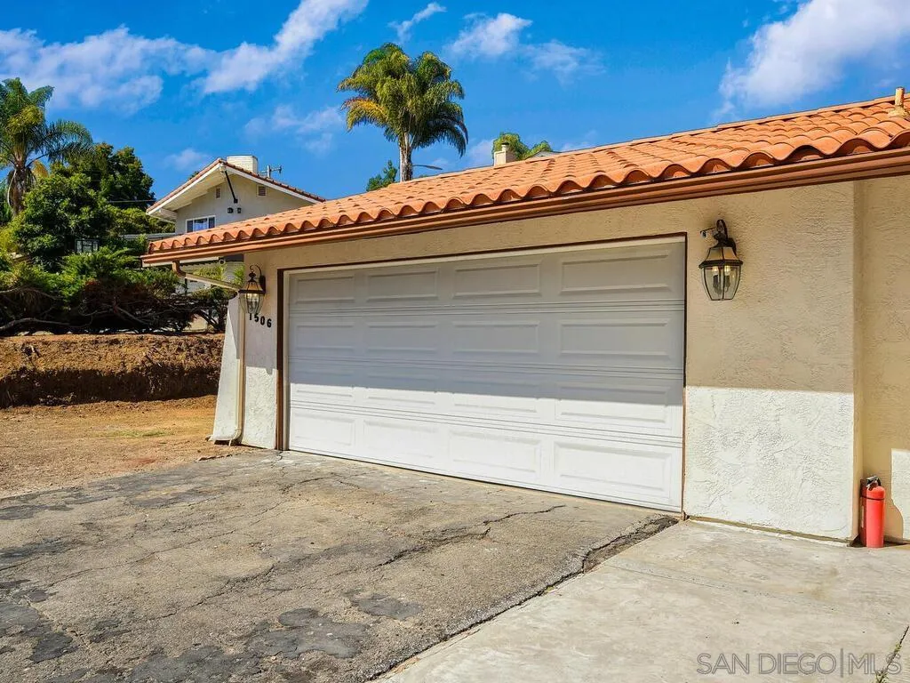 1506 Renwick Lane Vista, CA 92084 - Photo 12 of 28 a view of a parking space with potted plants