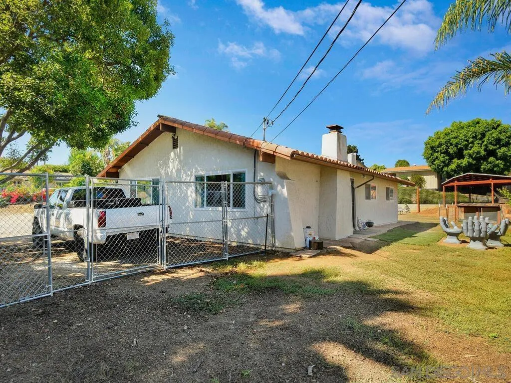 1506 Renwick Lane Vista, CA 92084 - Photo 15 of 28 a view of a white house with a yard
