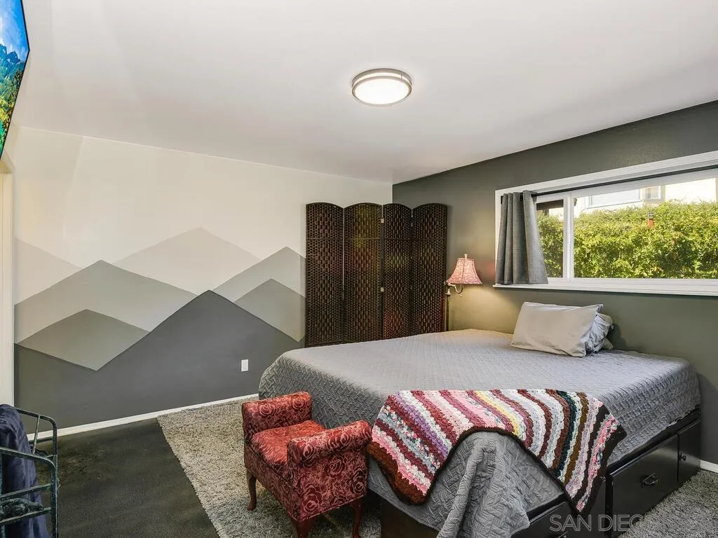 1506 Renwick Lane Vista, CA 92084 - Photo 16 of 28 a bedroom with a bed and wooden floor