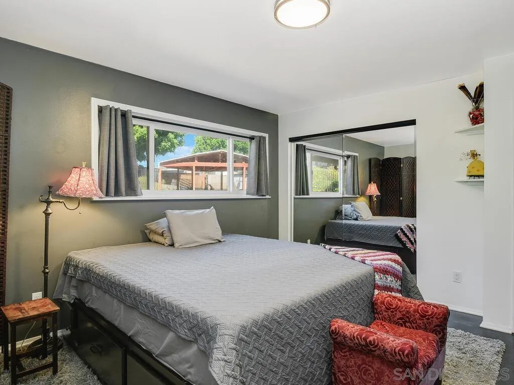 1506 Renwick Lane Vista, CA 92084 - Photo 17 of 28 a bedroom with a large bed and a window