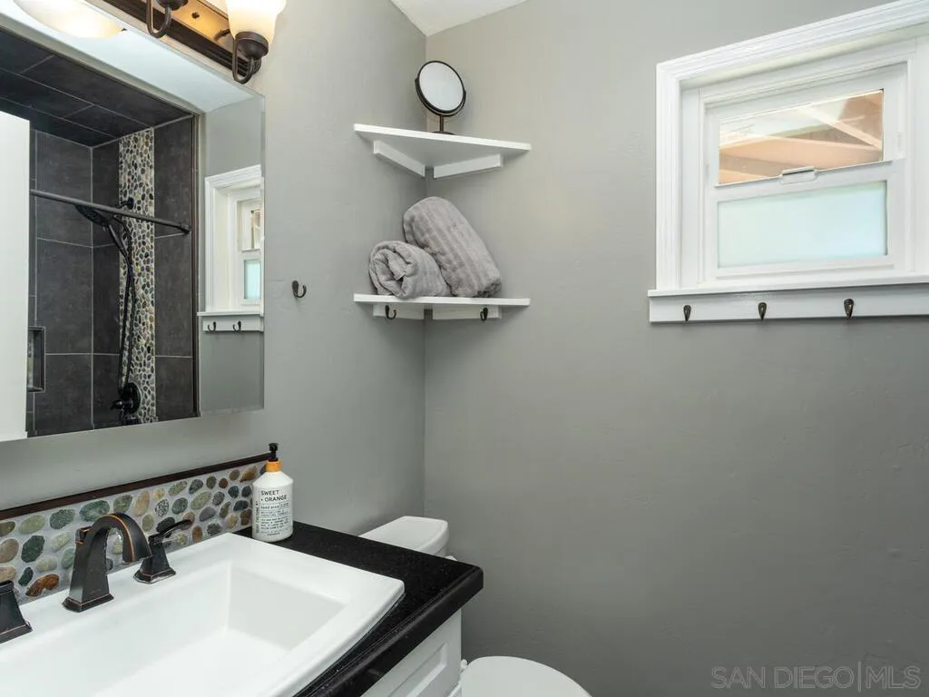 1506 Renwick Lane Vista, CA 92084 - Photo 18 of 28 a bathroom with a sink and a mirror