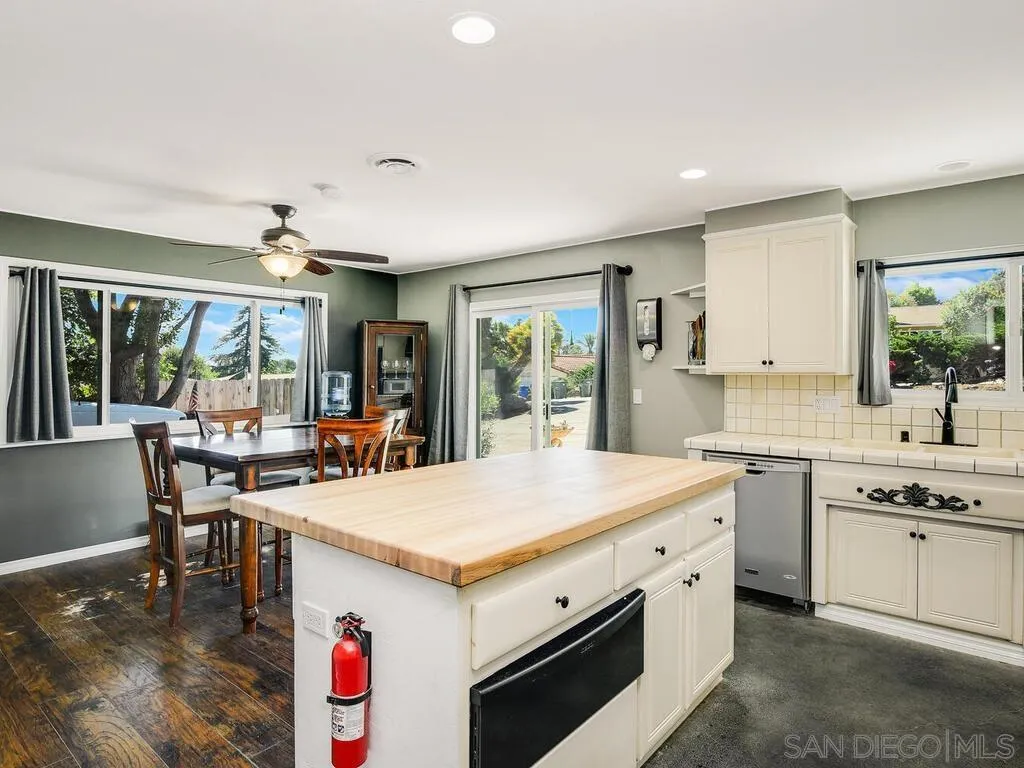 1506 Renwick Lane Vista, CA 92084 - Photo 2 of 28 a view of center island kitchen island with cabinets and couches