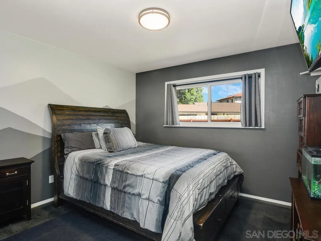 1506 Renwick Lane Vista, CA 92084 - Photo 22 of 28 a bedroom with a bed and a window