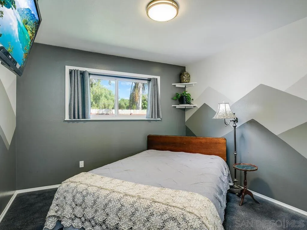1506 Renwick Lane Vista, CA 92084 - Photo 23 of 28 a bedroom with a bed and a window