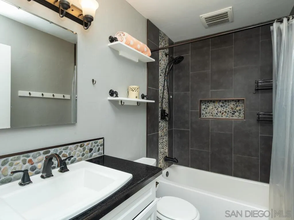 1506 Renwick Lane Vista, CA 92084 - Photo 25 of 28 a bathroom with a sink toilet and shower