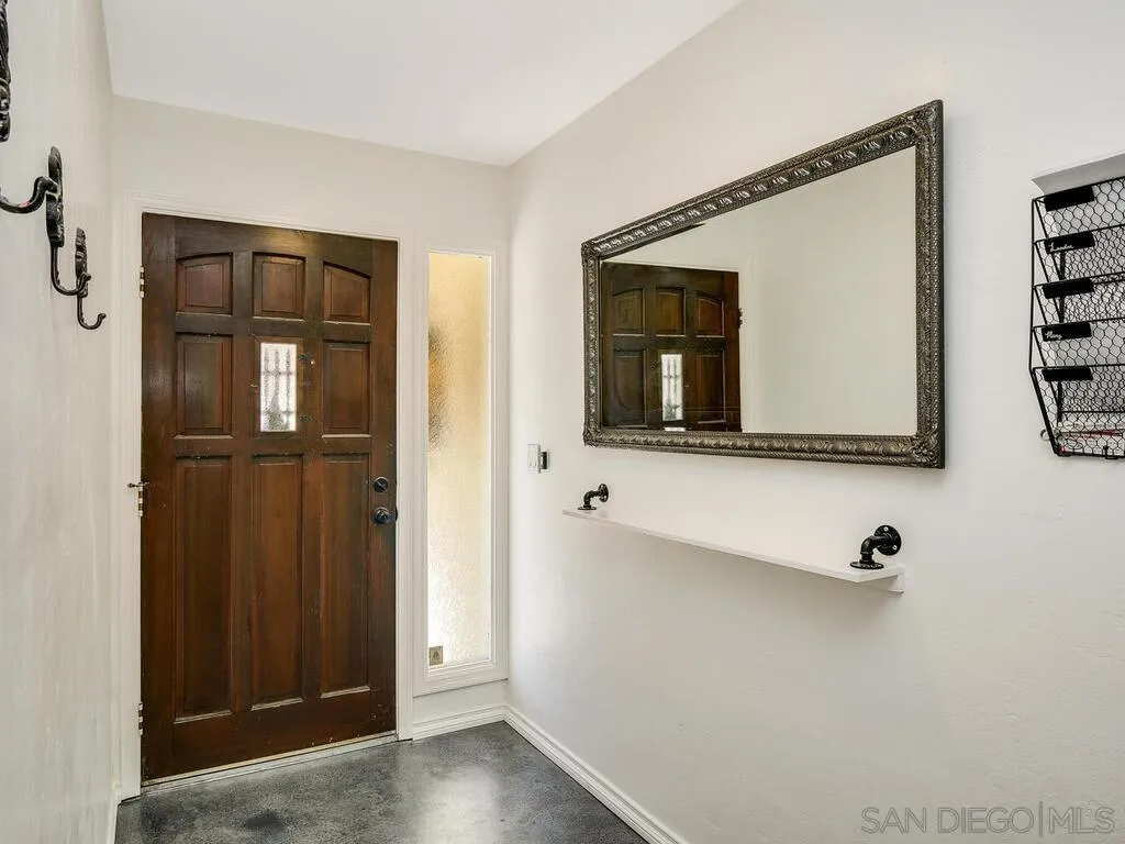 1506 Renwick Lane Vista, CA 92084 - Photo 26 of 28 a bathroom with a mirror and a sink