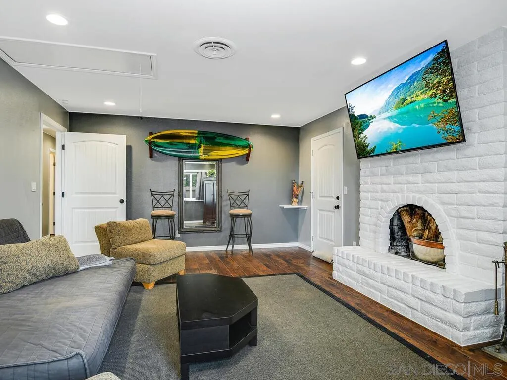 1506 Renwick Lane Vista, CA 92084 - Photo 7 of 28 a living room with furniture and a flat screen tv