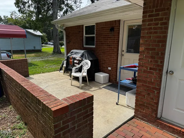 a backyard of a house with seating space