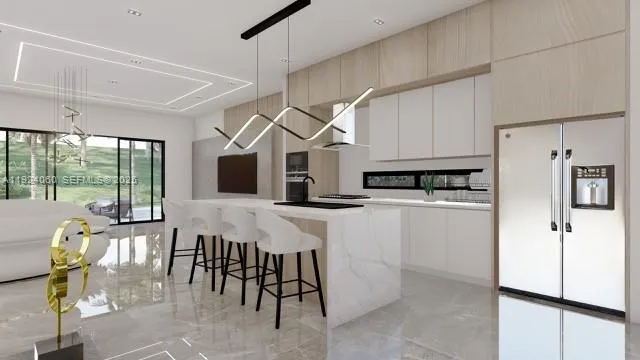 a kitchen with stainless steel appliances kitchen island granite countertop a refrigerator and microwave