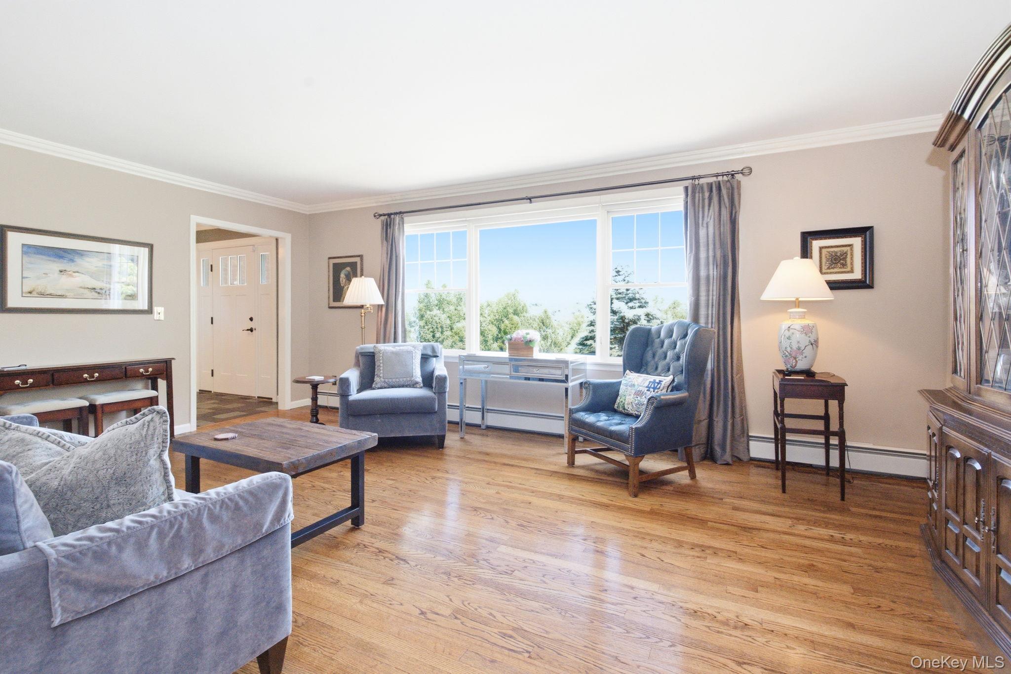 32 Bedell Road Katonah, NY 10536 - Photo 6 of 49 The living room captures long seasonal vistas from the home's elevated setting.