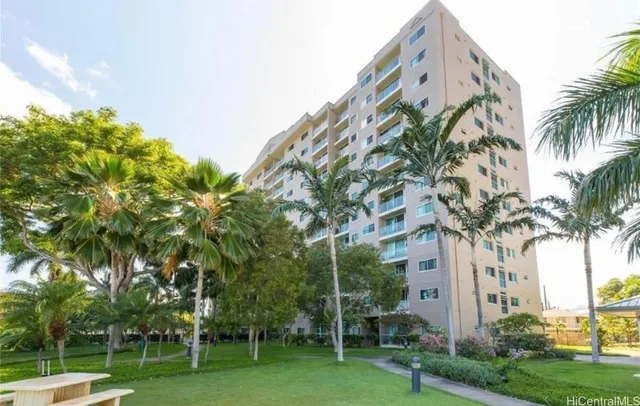 a view of a palm trees and a big yard