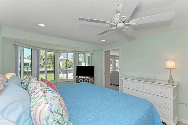 a bed room with a bed and a television