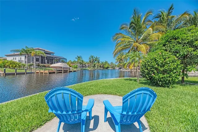 a view of a chair and table in the garden