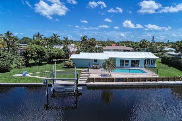 a view of a lake with a house in the background