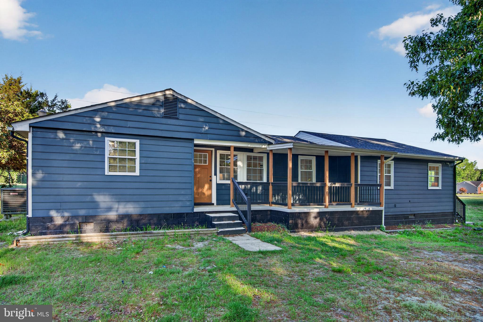 22045 Carters Gate Road Ruther Glen, VA 22546 - Photo 1 of 27 a front view of a house with a yard