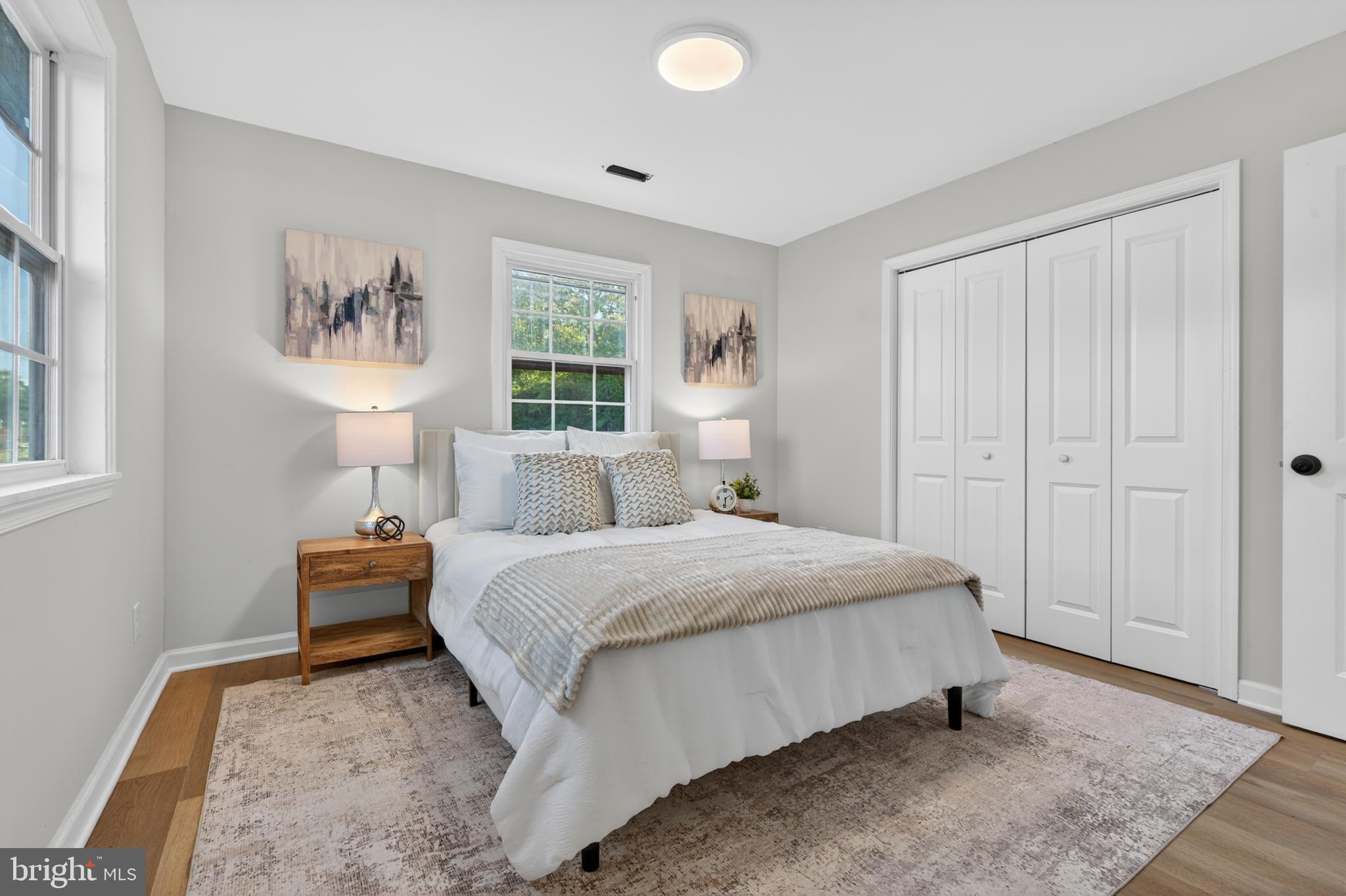 22045 Carters Gate Road Ruther Glen, VA 22546 - Photo 19 of 27 a bedroom with a bed and a lamp on dresser
