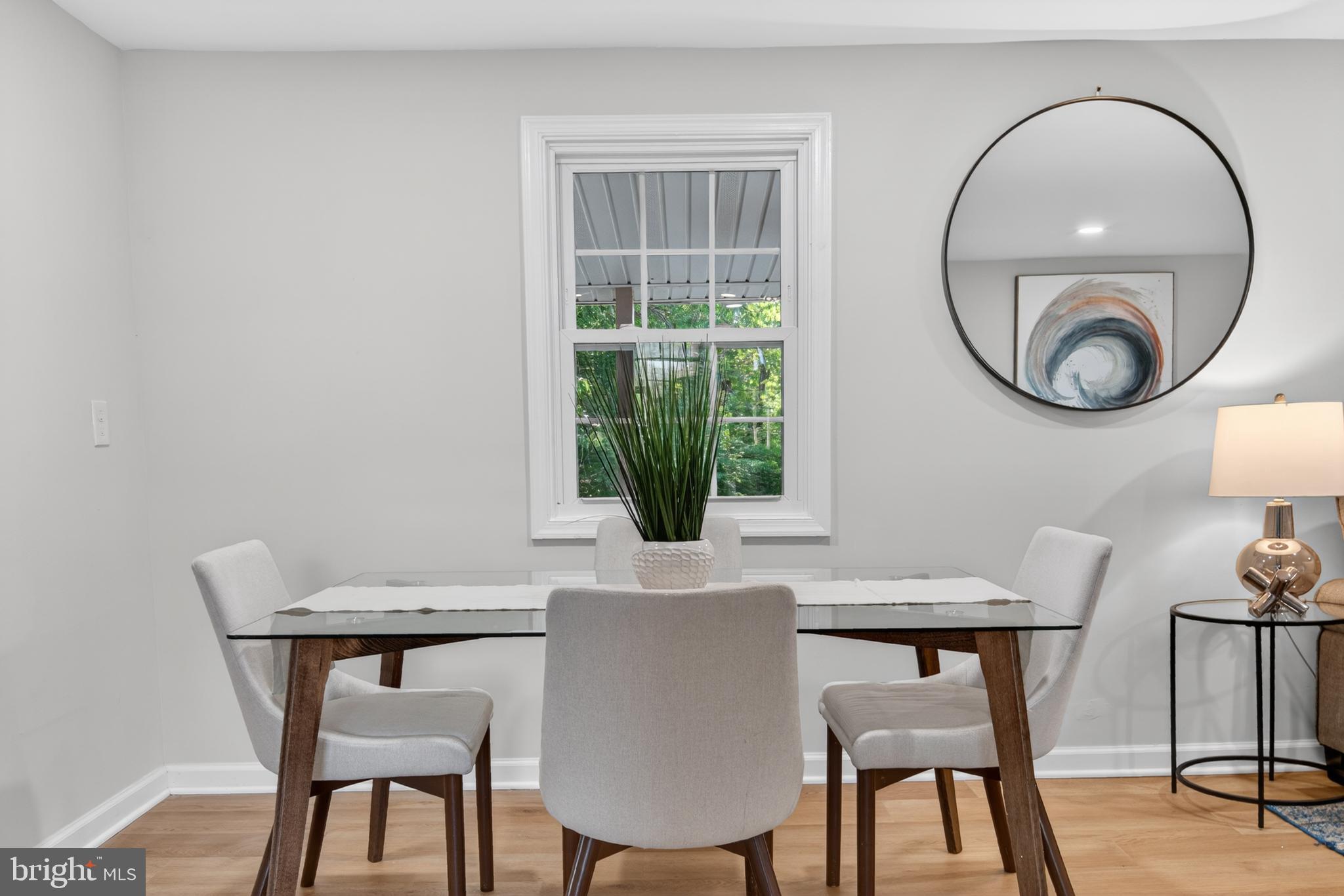 22045 Carters Gate Road Ruther Glen, VA 22546 - Photo 4 of 27 a view of a dining room with furniture and a window