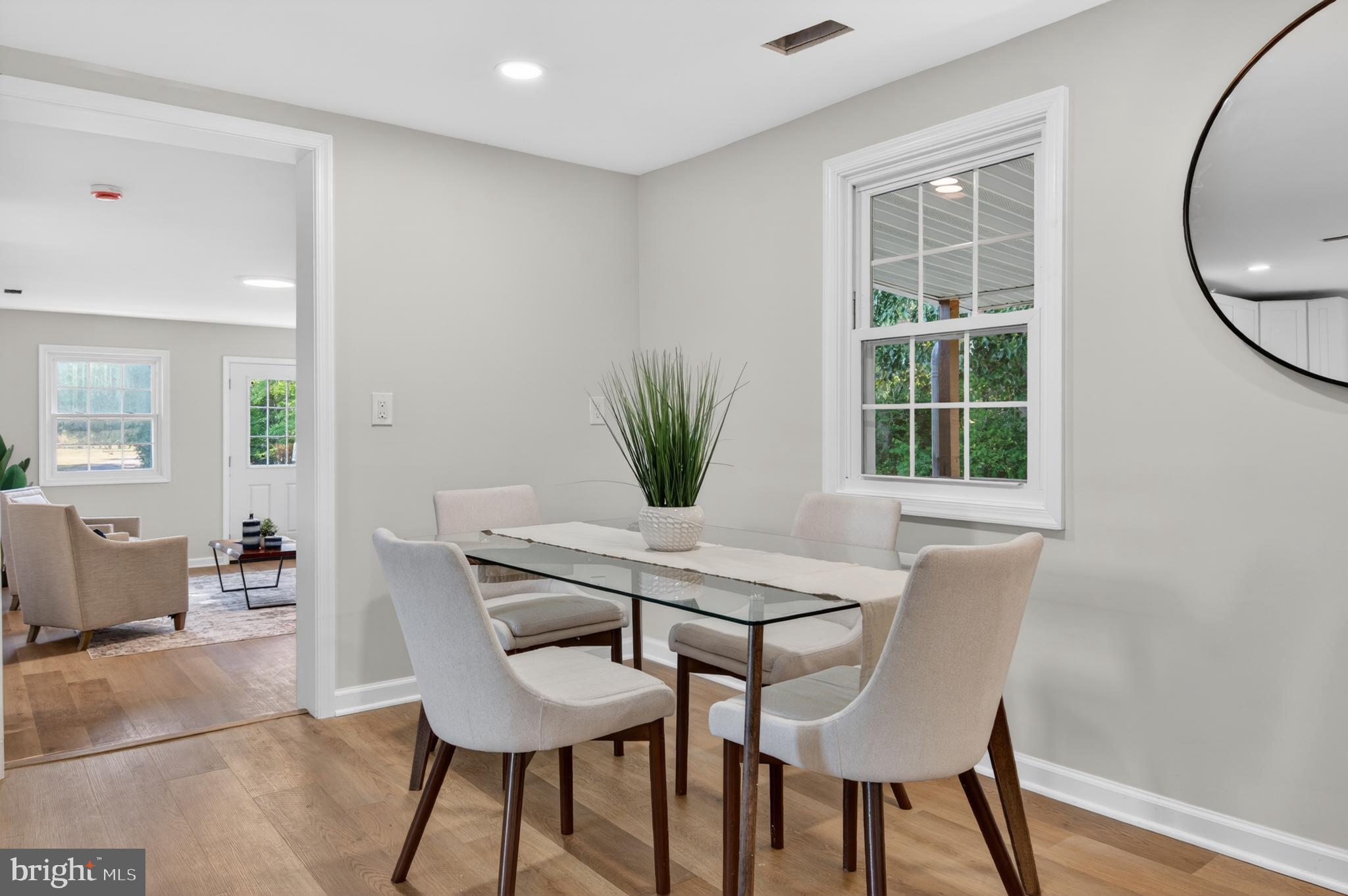 22045 Carters Gate Road Ruther Glen, VA 22546 - Photo 5 of 27 a view of a dining room with furniture and wooden floor