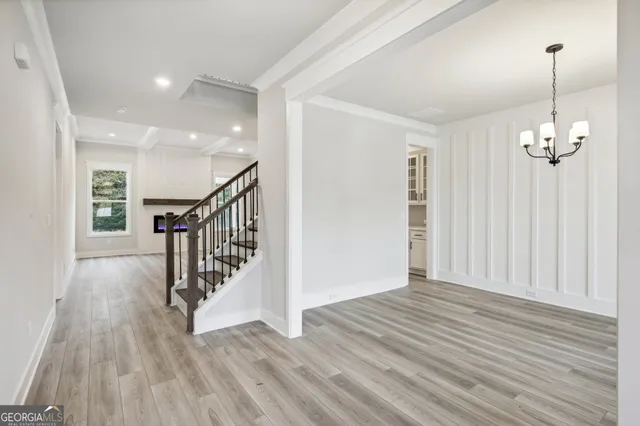 a view of a livingroom with wooden floor
