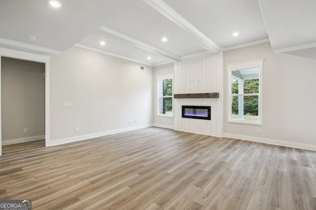 a kitchen with a sink cabinets and a wooden floor