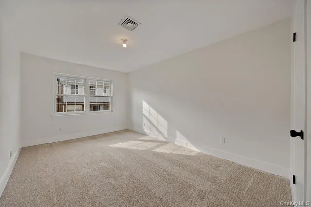 a view of empty room with windows
