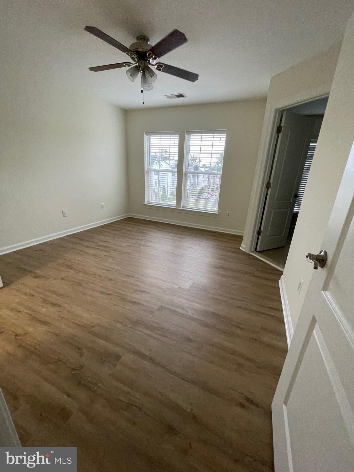 7454 Riding Meadow Way Manassas, VA 20111 - Photo 13 of 21 a view of an empty room with a window