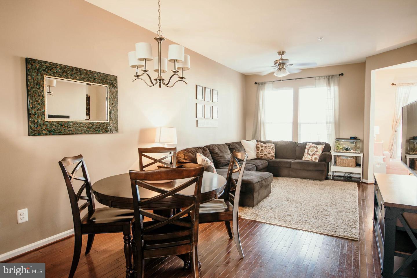 7454 Riding Meadow Way Manassas, VA 20111 - Photo 2 of 21 a view of a livingroom and dining room