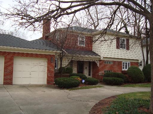 155 Akenside Road Riverside, IL 60546 - Photo 1 of 1 a front view of a house with a yard and garage