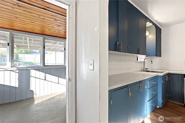 a bathroom with a sink and a large mirror