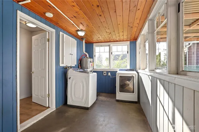a view of a kitchen with washer and dryer