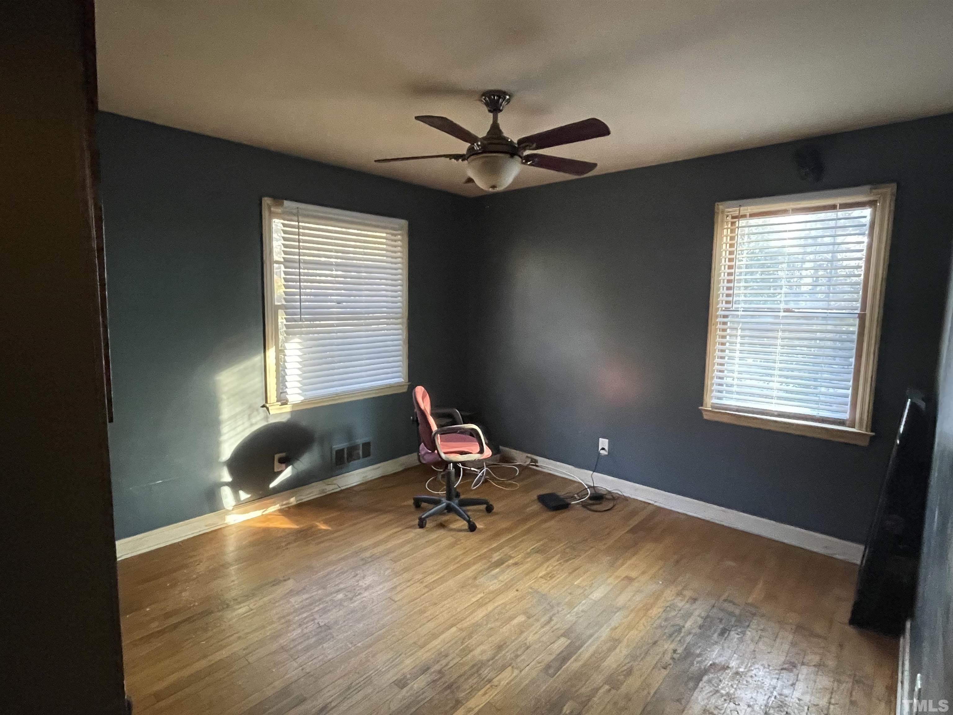 1518 Ashburton Road Raleigh, NC 27606 - Photo 7 of 10 a living room with a window
