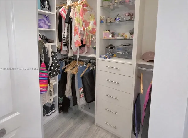 a bedroom with a bed and a desk