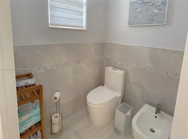 a bathroom with a shower and toilet