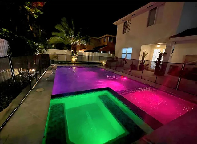 a living room with furniture potted plant and a fireplace