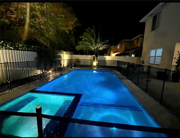 a view of a backyard with large trees