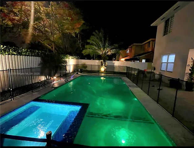 a front view of a house with a garden and yard