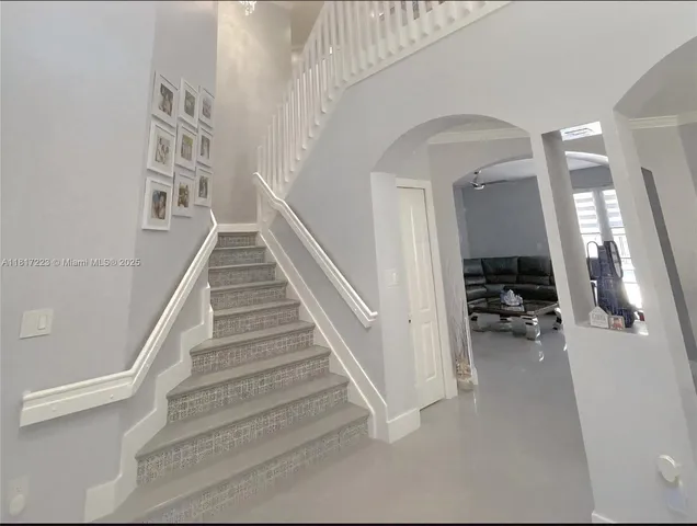 a front view of a house with a porch and furniture