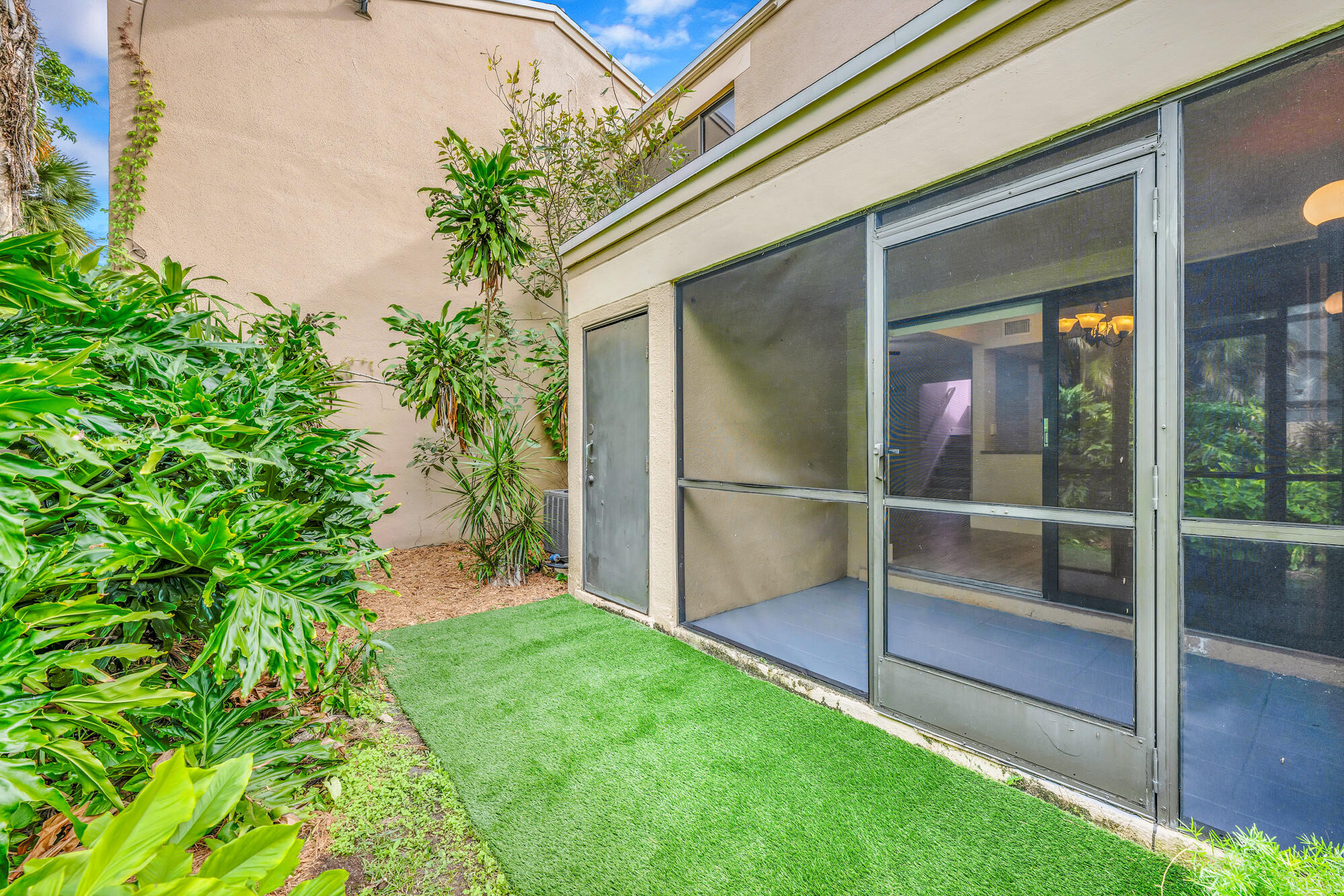 1169 Northwest 13th Street, Unit 1 Boca Raton, FL 33486 - Photo 15 of 20 a view of outdoor space and yard