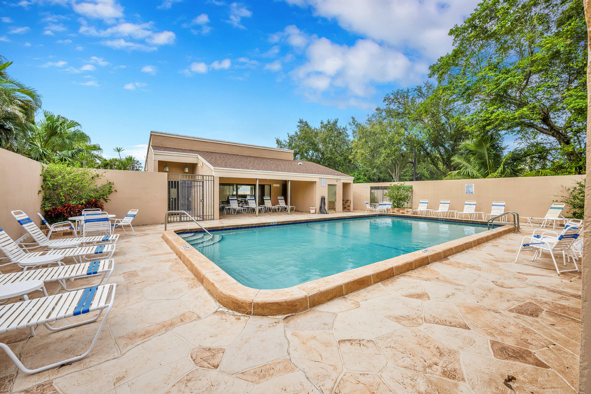 1169 Northwest 13th Street, Unit 1 Boca Raton, FL 33486 - Photo 18 of 20 a view of swimming pool with seating space