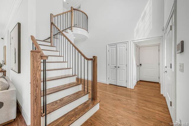 1 Kewanee Road New Rochelle, NY 10804 - Photo 20 of 36 a view of a hallway with wooden floor and entryway