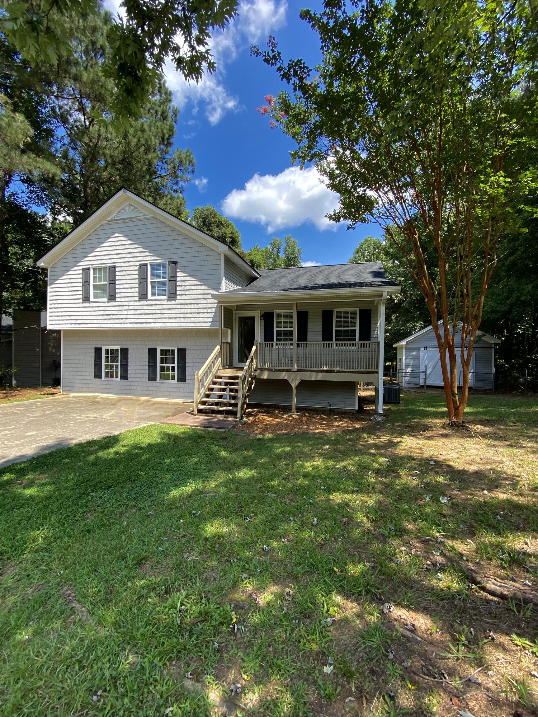 153 Kylee Court Villa Rica, GA 30180 - Photo 1 of 1 a front view of a house with a garden